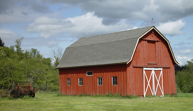 image: a red barn in a farm setting