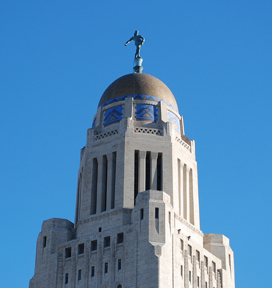 Nebraska state capital dome against blue sky